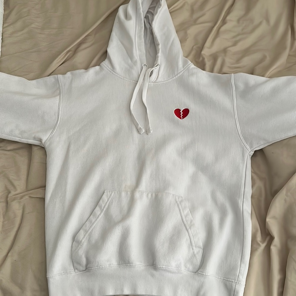 White Zuni Sportswear hoodie with red heart break design.